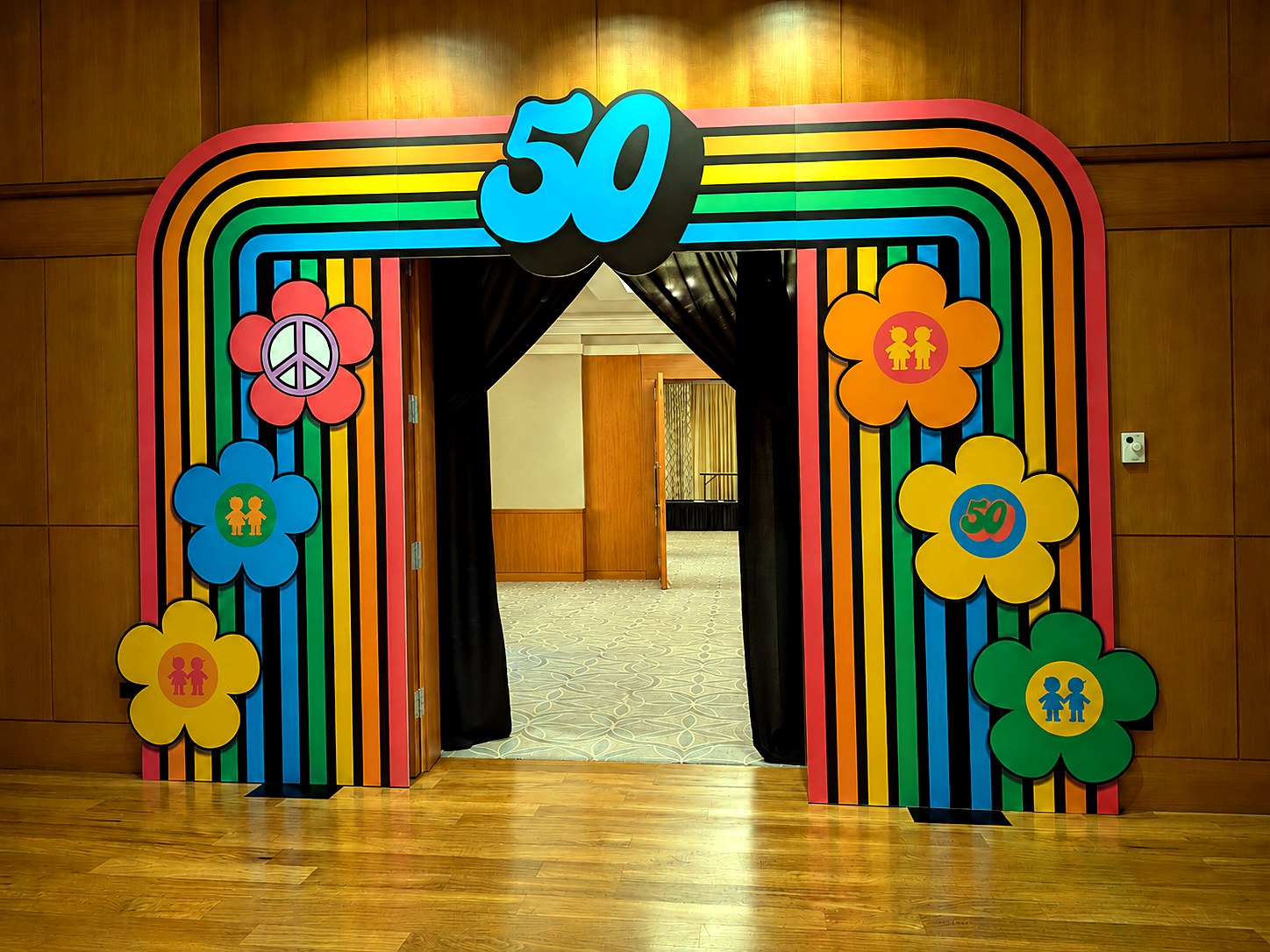 Colorful retro custom entrance installation for a corporate and nonprofit gala