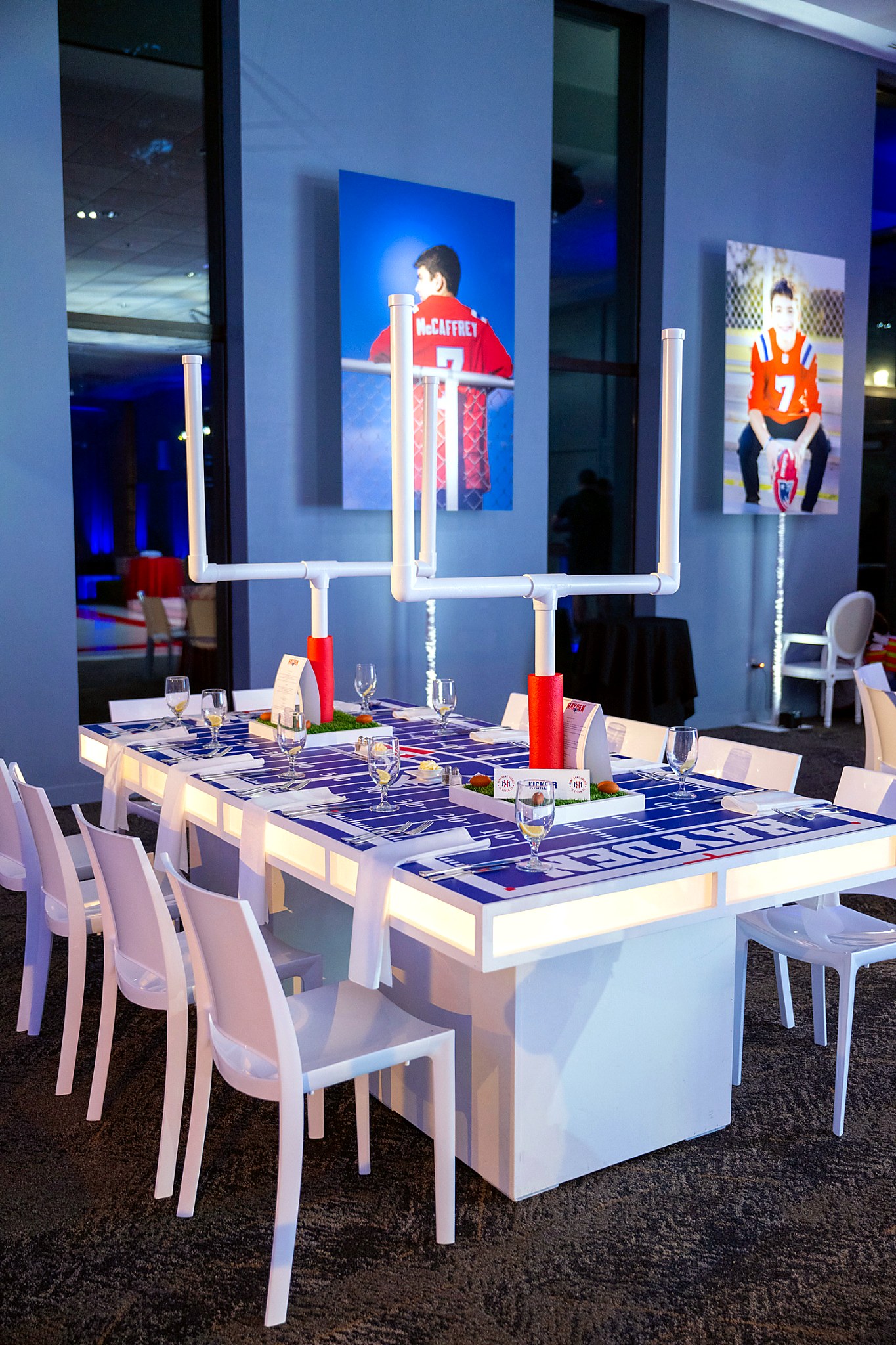 Custom illuminated football field dining table and goalpost centerpieces for a bar mitzvah